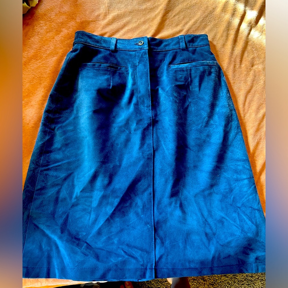 Blue leather skirt.